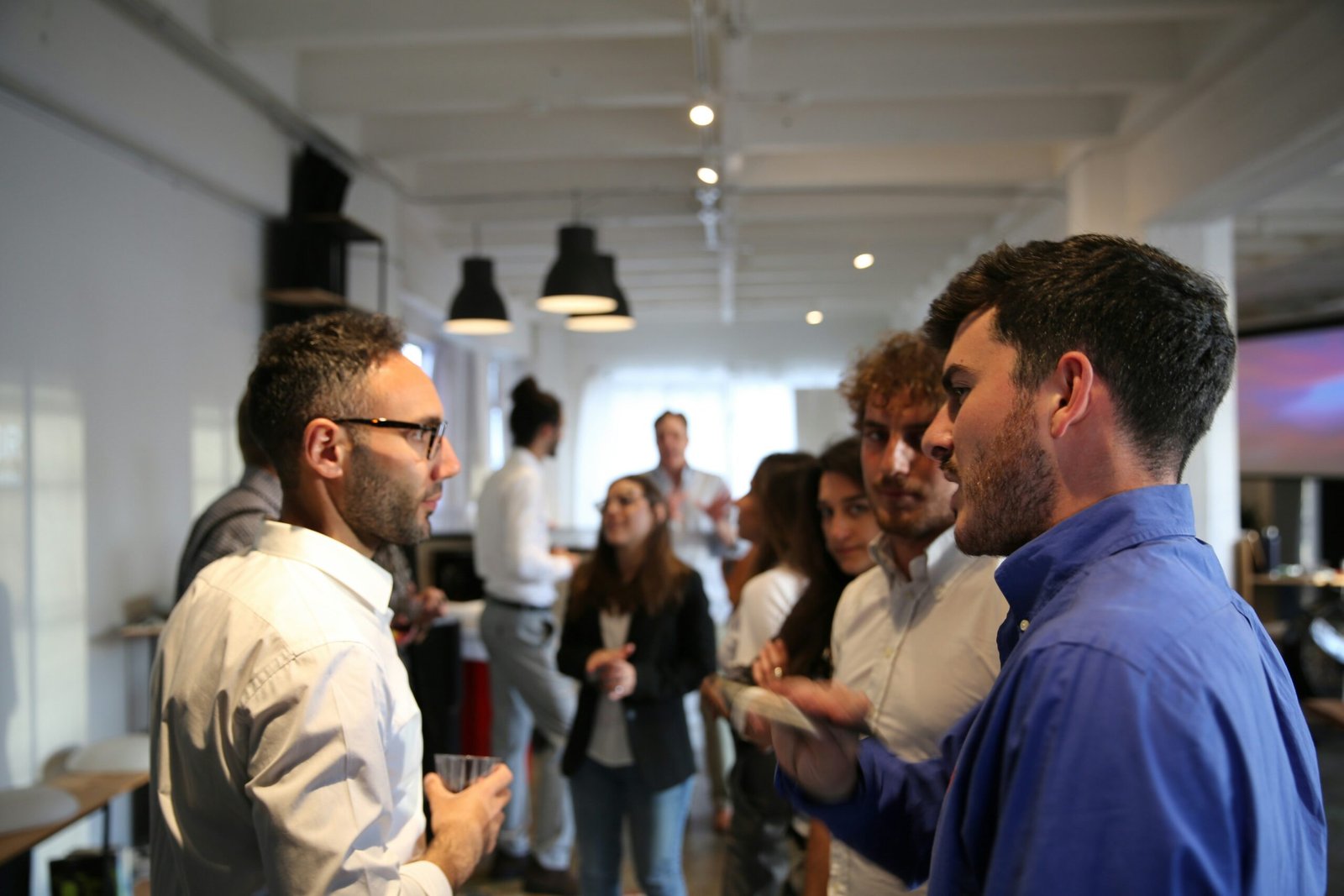 a group of people standing in a room